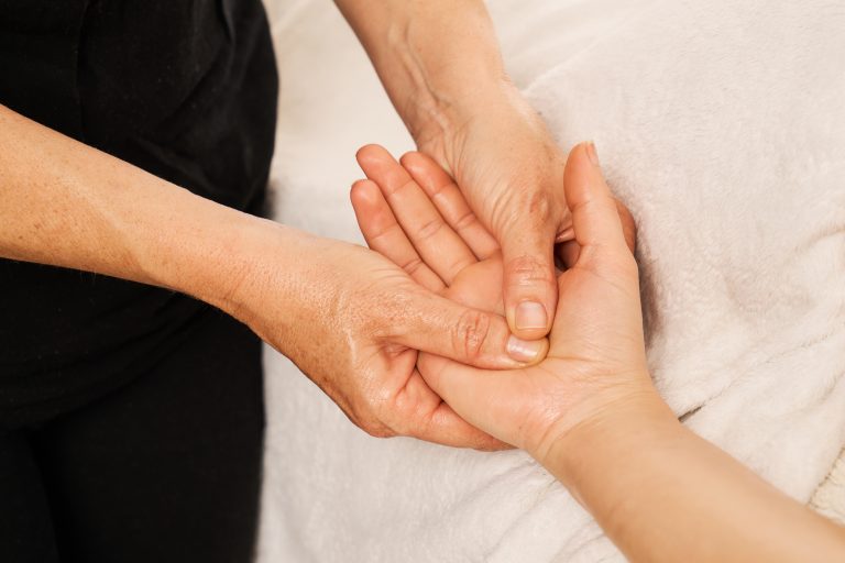 Physiotherapist performing Manual Therapy Camrose assessment for joint and muscle pain