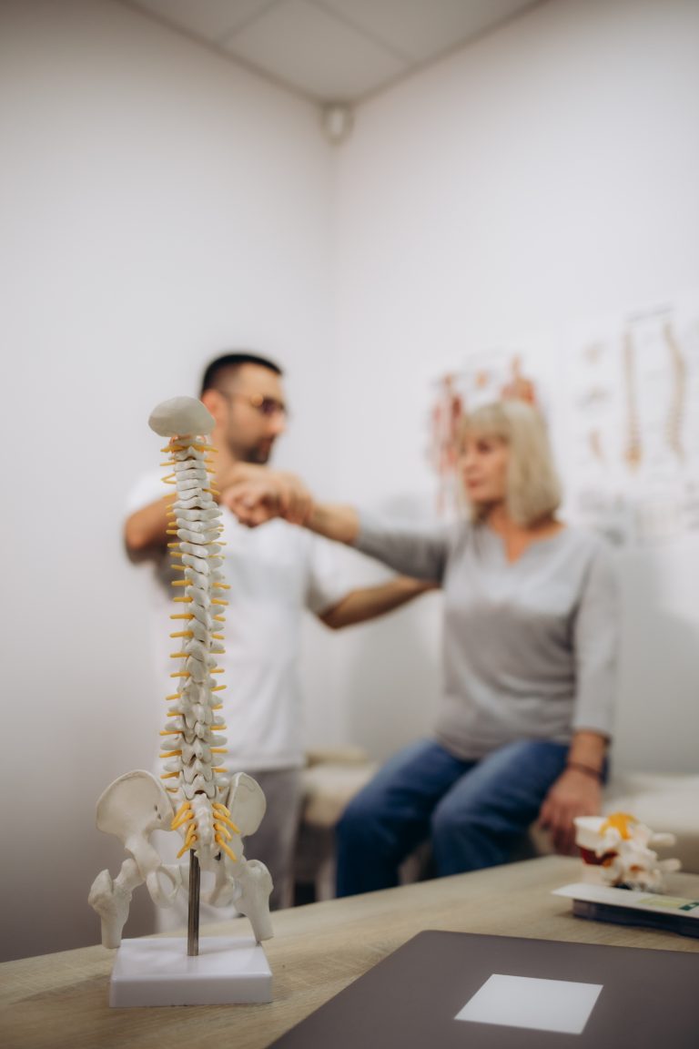 Chiropractic Care for Neck pain and Whiplash 3 First Chiropractic Visit in Camrose performing a spinal assessment for a patient Image Caption: Comprehensive chiropractic evaluations.