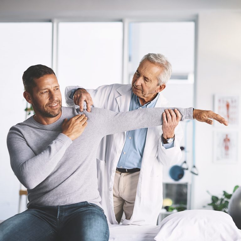 Sports injury rehabilitation session during Physiotherapy in Camrose with patient doing recovery exercises